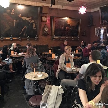 Caffe Reggio - About 2/3rds of the inside, capturing the ambience and the close-packed tables.  Caffe Reggio 11/29/16 - Italian Near Me - New York, New York