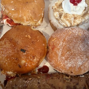 Pinkbox Doughnuts - Top: Left to right: Sub Shorty. Cherry Bomb. Blow Torch Raspberry Squeeze. Porky bar - Donuts Near Me - St. George, Utah Pinkbox Doughnuts - Top: Left to right: Sub Shorty. Cherry Bomb. Blow Torch Raspberry Squeeze. Porky bar - Donuts Near Me - St. George, Utah