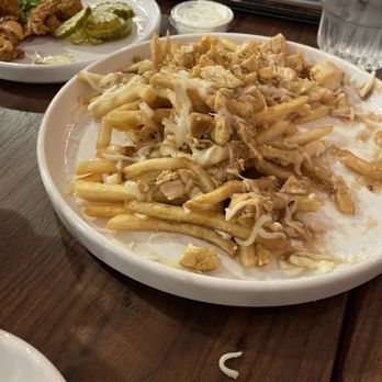 The Chicken Koop - Poutine fries (pic taken after we got into them). - Chicken Shop Near Me - Downey, California The Chicken Koop - Poutine fries (pic taken after we got into them). - Chicken Shop Near Me - Downey, California