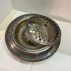 Vintage Pearl - Antique silver-plated frog. it is a pedestal bowl that you place cut flowers and place in the holes. Makes a beautiful center piece.