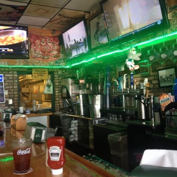 Beef 'O' Brady's - The bar area with the kitchen window where all the delicious food comes from. - American Near Me - Lynn Haven, Florida