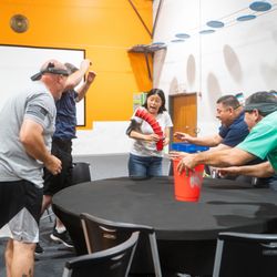 Group Dynamix - Group of colleagues playing a table-top game