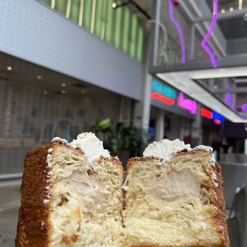 Shakkar - a hand holding a half eaten pastry - Bakeries Near Me - Houston, Texas Shakkar - a hand holding a half eaten pastry - Bakeries Near Me - Houston, Texas