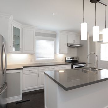 Zumin Home Centre - a kitchen with stainless steel appliances - General Contractors Near Me - Mississauga, Ontario Zumin Home Centre - a kitchen with stainless steel appliances - General Contractors Near Me - Mississauga, Ontario