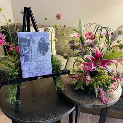 Riverwalk Floral Designs - Japanese Ikebana style arrangement and floral adorned book stand. Gorgeous!