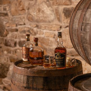 Havisham Bourbon Bar - three bottles of whiskey on a barrel - Whiskey Bars Near Me - Alto Pass, Illinois