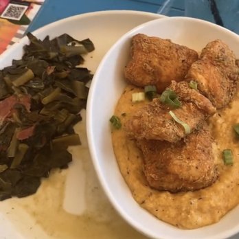 Lost & Found - Fried salmon and Cajun grits with collard greens - Cocktail Bars Near Me - Houston, Texas