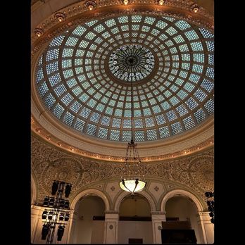Chicago Cultural Center - The terrific 200-ft-wide 1897 mosaic Tiffany Dome. The center of the dome shows the signs of the zodiac - Cultural Center Near Me - Chicago, Illinois