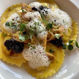 Chanterelle ravioli with squash blossom