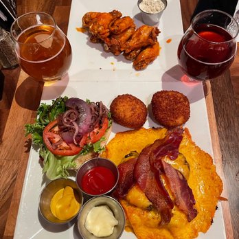 Zero One Ale House - This is the Buffalo wings, the cheddar blanket burger and the brew on the right is called the Unknown. Make sure you get that one. - Breweries Near Me - San Angelo, Texas Zero One Ale House - This is the Buffalo wings, the cheddar blanket burger and the brew on the right is called the Unknown. Make sure you get that one. - Breweries Near Me - San Angelo, Texas