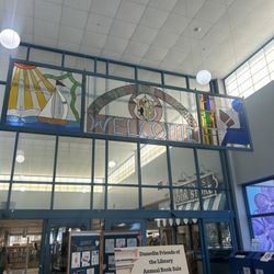 Dunedin Public Library - Beautiful stained glass and the Olympic exhibit is in the glass case