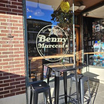 Benny Marconi's - The restaurant name painted on one of the windows and outdoor seating area. - Italian Near Me - Roanoke, Virginia Benny Marconi's - The restaurant name painted on one of the windows and outdoor seating area. - Italian Near Me - Roanoke, Virginia