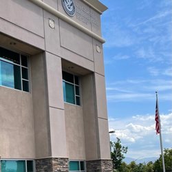 U.S Citizenship and Immigration Services - The back of the building is the entrance.