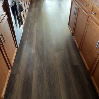 Elite Flooring Repair - Another view of the kitchen area where the water leak was at after work was completed. - Flooring Near Me Elite Flooring Repair - Another view of the kitchen area where the water leak was at after work was completed. - Flooring Near Me