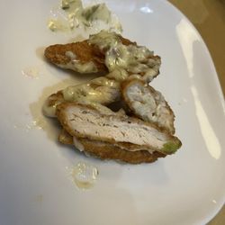Boston Pizza - This chicken has a coating, which I can't eat, and a delicious dill sauce on it. I had asked for grilled chicken.