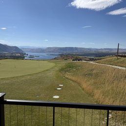 View of the putting green and river in the background from the room. View of the putting green and river in the background from the room.