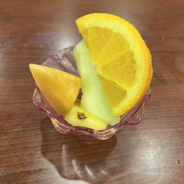an orange slice and a melon slice an orange slice and a melon slice