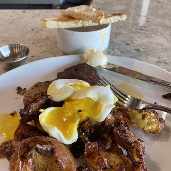 Good Lookin' - 2 poached house made sausage and the best home fries you'll ever have. - Breakfast & Brunch Near Me - Omaha, Nebraska Good Lookin' - 2 poached house made sausage and the best home fries you'll ever have. - Breakfast & Brunch Near Me - Omaha, Nebraska