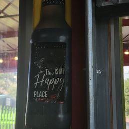 Right by the door so you can open your ice'cold glass bottled Coca-Cola.