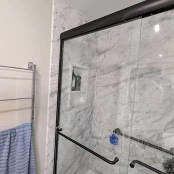 Re-Bath - The black frame should be where the marble wall panel ends. Shouldn't be 4 inches back. - General Contractors Near Me - Richardson, Texas Re-Bath - The black frame should be where the marble wall panel ends. Shouldn't be 4 inches back. - General Contractors Near Me - Richardson, Texas