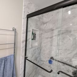 Re-Bath - The black frame should be where the marble wall panel ends. Shouldn't be 4 inches back.
