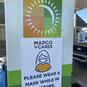 MAPCO Mart - a sticker with a woman wearing a mask while in the store - Convenience Stores Near Me - Alexandria, Alabama