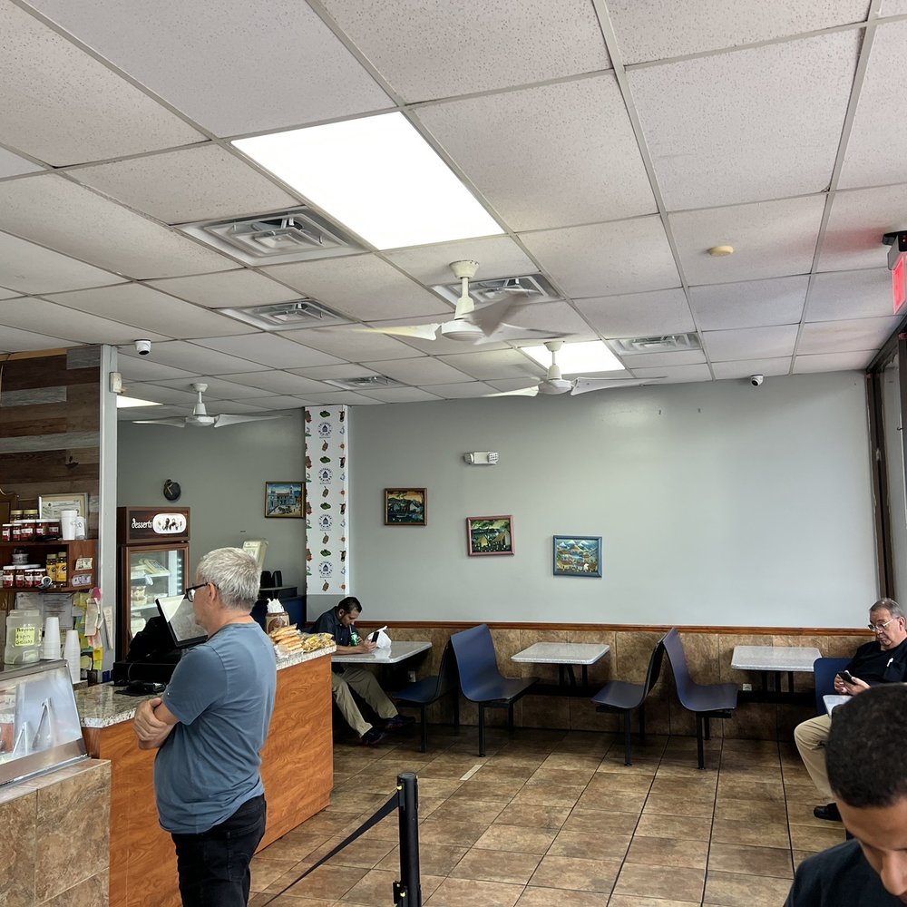 Fritanga Monimbo - a man standing at a counter - Latin American Near Me - Fontainebleau, Florida Fritanga Monimbo - a man standing at a counter - Latin American Near Me - Fontainebleau, Florida