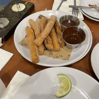 Holbox - 2 orders of churros, partially eaten - Latin American Near Me - Los Angeles, California