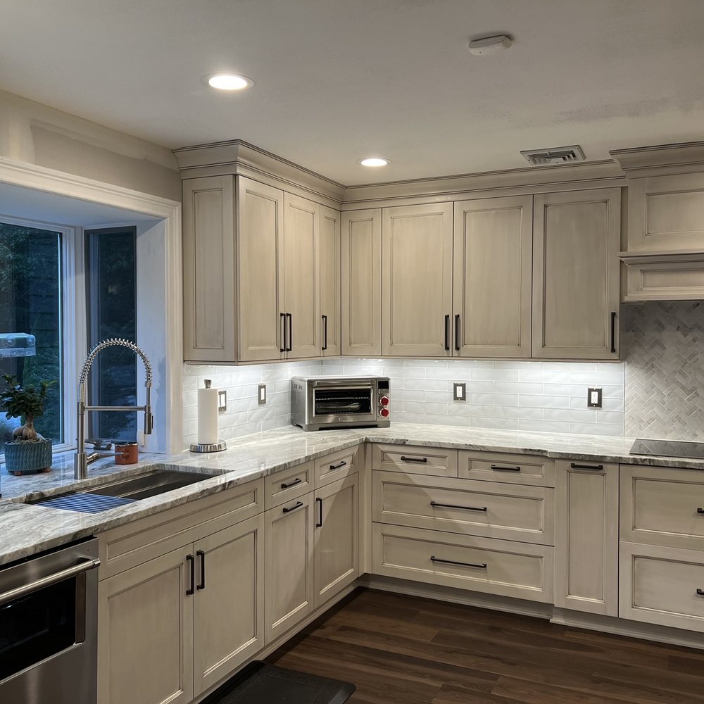 Artistic Cabinetry - a kitchen with white cabinets and marble countertops - Cabinetry Near Me - Smithtown, New York