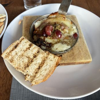 Nikanos - Flaming saganaki cheese with fennel and grapes - Greek Near Me - Ogunquit, Maine