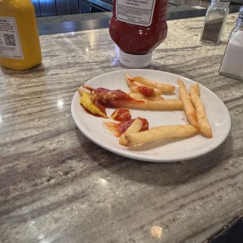 Metro Grill and Bar - Fries stacked high at the beginning. Hot, fresh and not house made. No room to actually dip into ketchup and mustard. - American Near Me - Joliet, Illinois