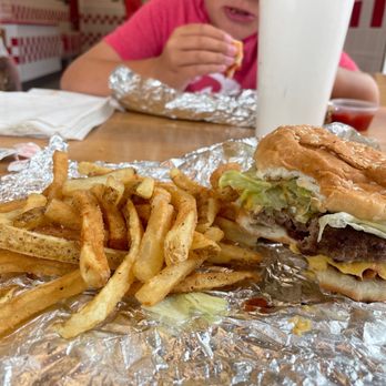 Five Guys - a hamburger and french fries on tin foil - Fast Food Near Me - Sutton, Massachusetts