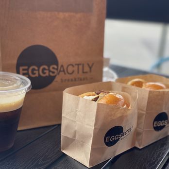 Eggsactly - a cup of coffee and a bag of doughnuts - Breakfast & Brunch Near Me - La Verne, California