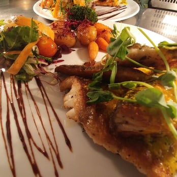 Michaelangelo's - Trio of fish - salmon, sea bass and cod with a white wine and saffron infused sauce - Italian Near Me - Clarkston, ERW Michaelangelo's - Trio of fish - salmon, sea bass and cod with a white wine and saffron infused sauce - Italian Near Me - Clarkston, ERW