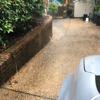 Dr Dan's Landscaping & Architectural Design - The geyser pouring out of the wall with water, rock and sand from the well. They put two downspout wells in a small area not one to the yard - Irrigation Near Me - Virginia Beach, Virginia Dr Dan's Landscaping & Architectural Design - The geyser pouring out of the wall with water, rock and sand from the well. They put two downspout wells in a small area not one to the yard - Irrigation Near Me - Virginia Beach, Virginia