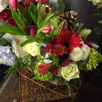 Lavanda Flowers & Gifts - Holiday theme arranged in a sleigh- with a penguin hidden! Cute! - Florists Near Me