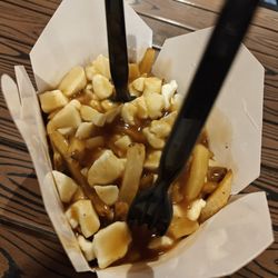Smokes Poutinerie - Artificial tasting poutine with rubbery cheese.