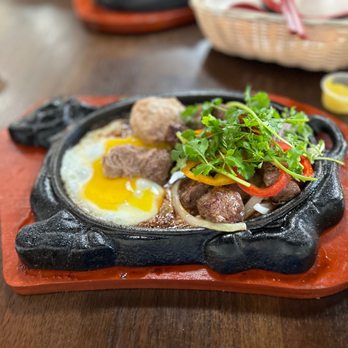 Tan Dinh Cafe - a plate of food on a table - Vietnamese Near Me - San Jose, California Tan Dinh Cafe - a plate of food on a table - Vietnamese Near Me - San Jose, California
