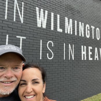 Vigilant Hope Roasting - a man and woman standing in front of a brick wall - Coffee Roasteries Near Me - Wilmington, North Carolina Vigilant Hope Roasting - a man and woman standing in front of a brick wall - Coffee Roasteries Near Me - Wilmington, North Carolina