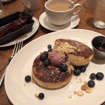 CBD Provisions - Hotcakes with lemon and blueberry, bacon and French presses coffee - Brasseries Near Me - Dallas, Texas