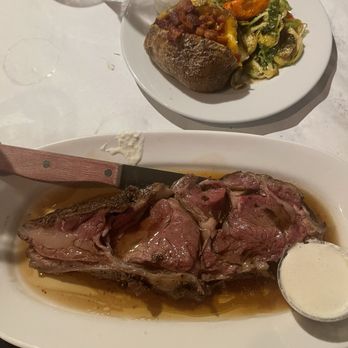 Sandra's on the Park - "Prime Rib" loaded baked potato and Brussels sprouts - American Near Me - Hales Corners, Wisconsin Sandra's on the Park - "Prime Rib" loaded baked potato and Brussels sprouts - American Near Me - Hales Corners, Wisconsin