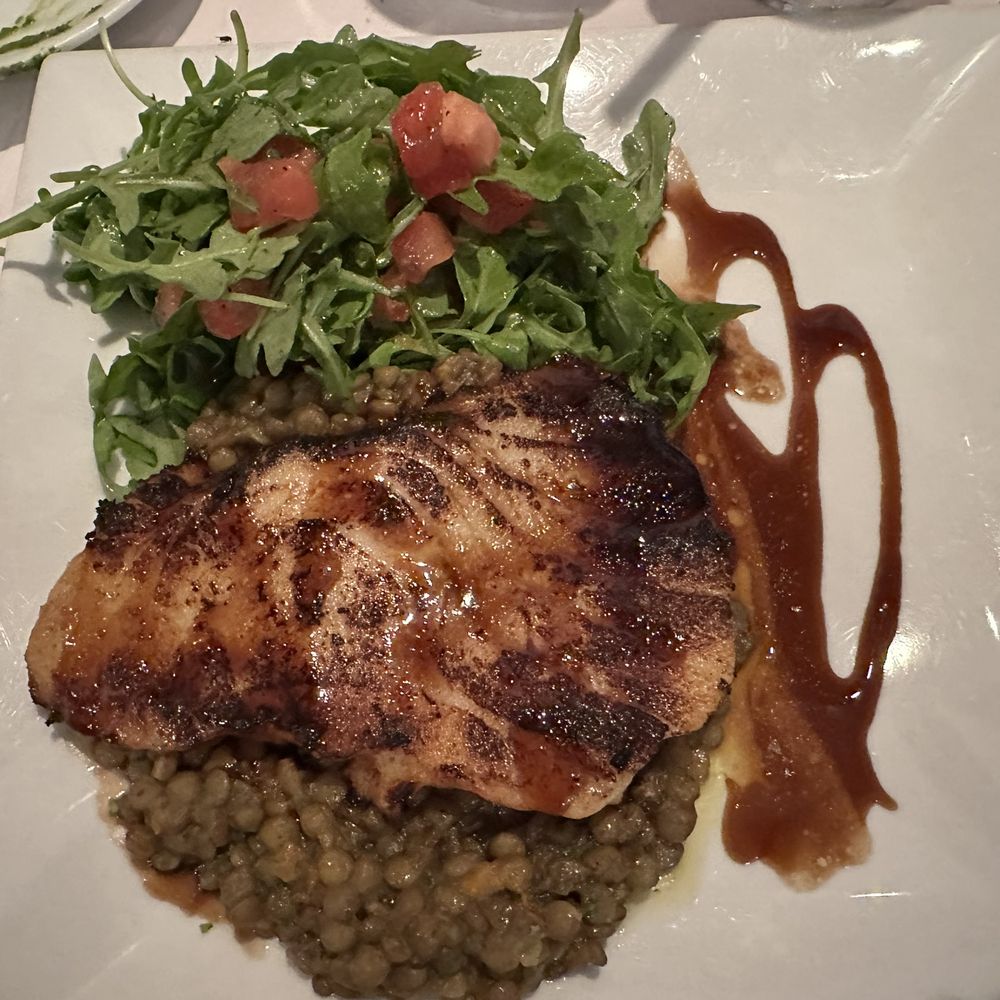 Locanda Veneta - Chilean Sea Bass with Lentils and Arugula salad - Italian Near Me - Los Angeles, California Locanda Veneta - Chilean Sea Bass with Lentils and Arugula salad - Italian Near Me - Los Angeles, California