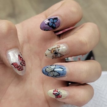 Creative Nails & Spa - My daughter's You can see the butterfly wings didn't transfer. There's extra parts of the hologram stickers adhered to the nail - Nail Salons Near Me - West Covina, California