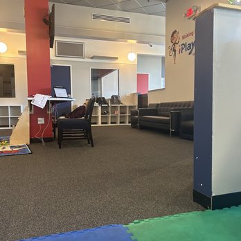 iPlayology - Reading area with books, work area for parents with chargers and outlets for computers and phones, sitting for resting - Playgrounds Near Me - Corona, California
