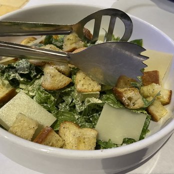 Patsy's Pizzeria - Crouton dish with a side of salad two pieces of Parmesan cheese. Lol, tongs to lift huge portion. - Italian Near Me - New York, New York