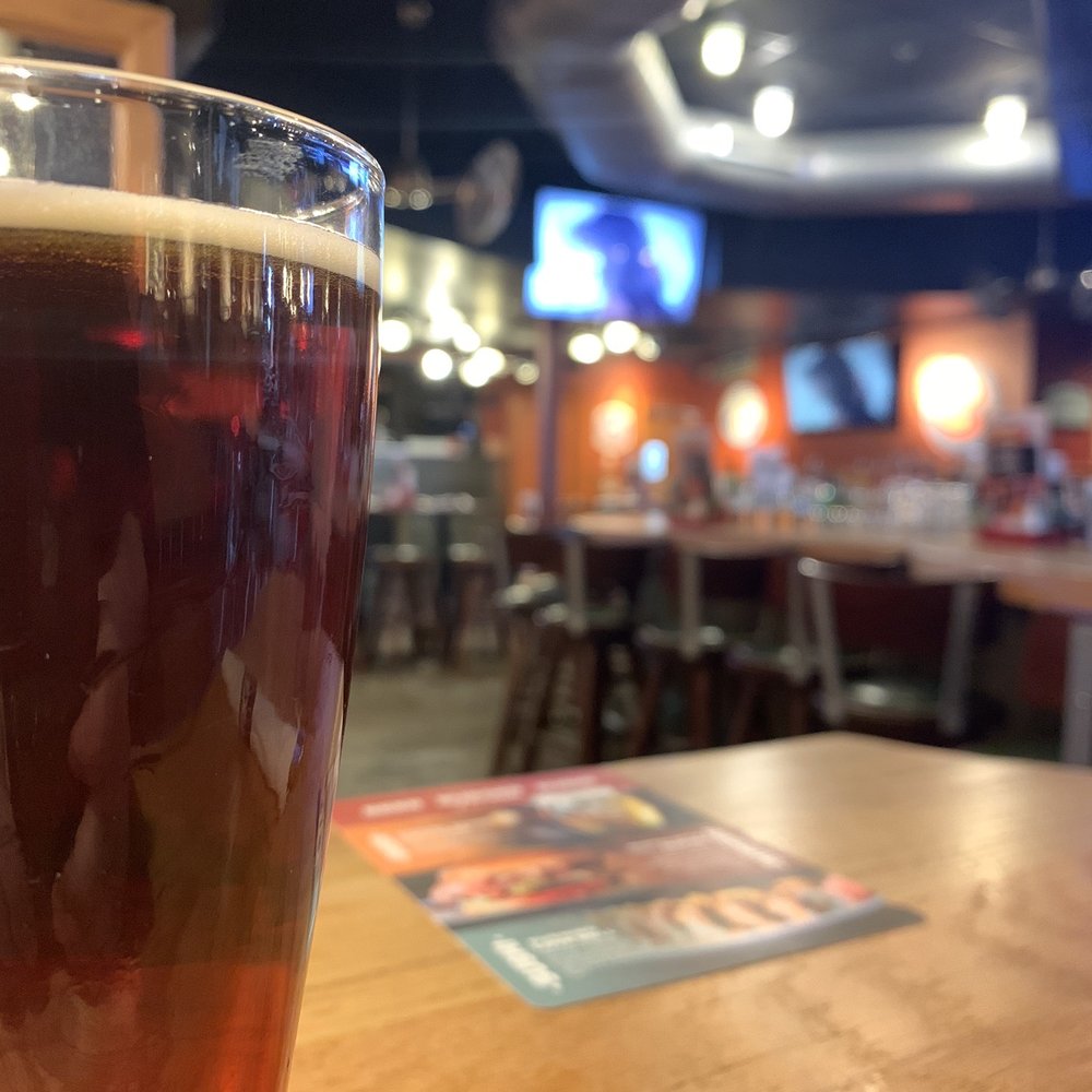 Drake's - a pint of beer on a table - Burgers Near Me - Florence, Kentucky