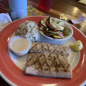 Surf Hut - Grilled mahi with lemon sauce, rice and (really amazing) vegetables. - Seafood Near Me - Destin, Florida Surf Hut - Grilled mahi with lemon sauce, rice and (really amazing) vegetables. - Seafood Near Me - Destin, Florida