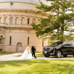 Bhutta Limousine Service - Bride and groom arriving in style with our luxury Cadillac Escalade SUV. Professional wedding transportation service in Chicago