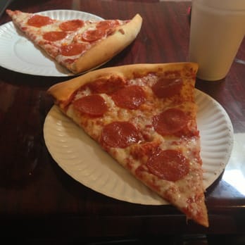 Patellini's Pizza - Huge slices of pizza, those are just average sized paper plates. - Pizza Near Me - Sarasota, Florida Patellini's Pizza - Huge slices of pizza, those are just average sized paper plates. - Pizza Near Me - Sarasota, Florida
