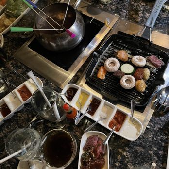 The Melting Pot - Entree with Coq Au Vin and Cast Iron Skillet Cooking Styles - Fondue Near Me - Gaithersburg, Maryland The Melting Pot - Entree with Coq Au Vin and Cast Iron Skillet Cooking Styles - Fondue Near Me - Gaithersburg, Maryland